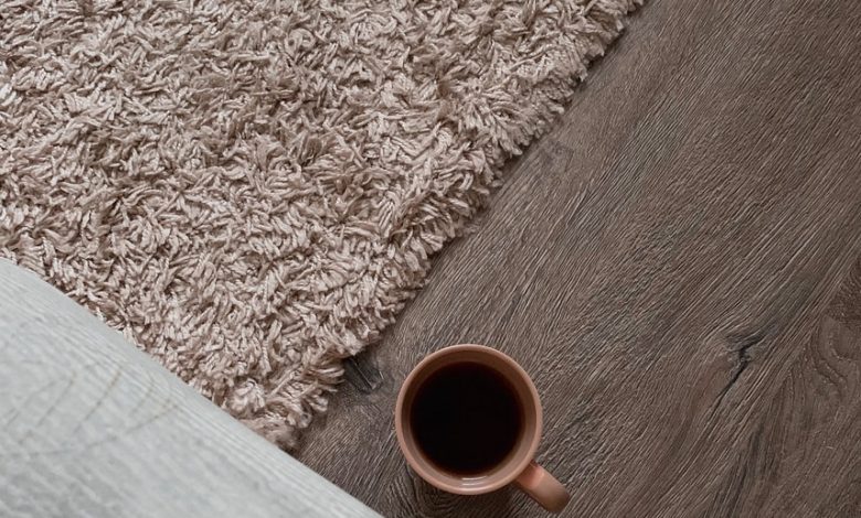 white ceramic mug on brown wooden table